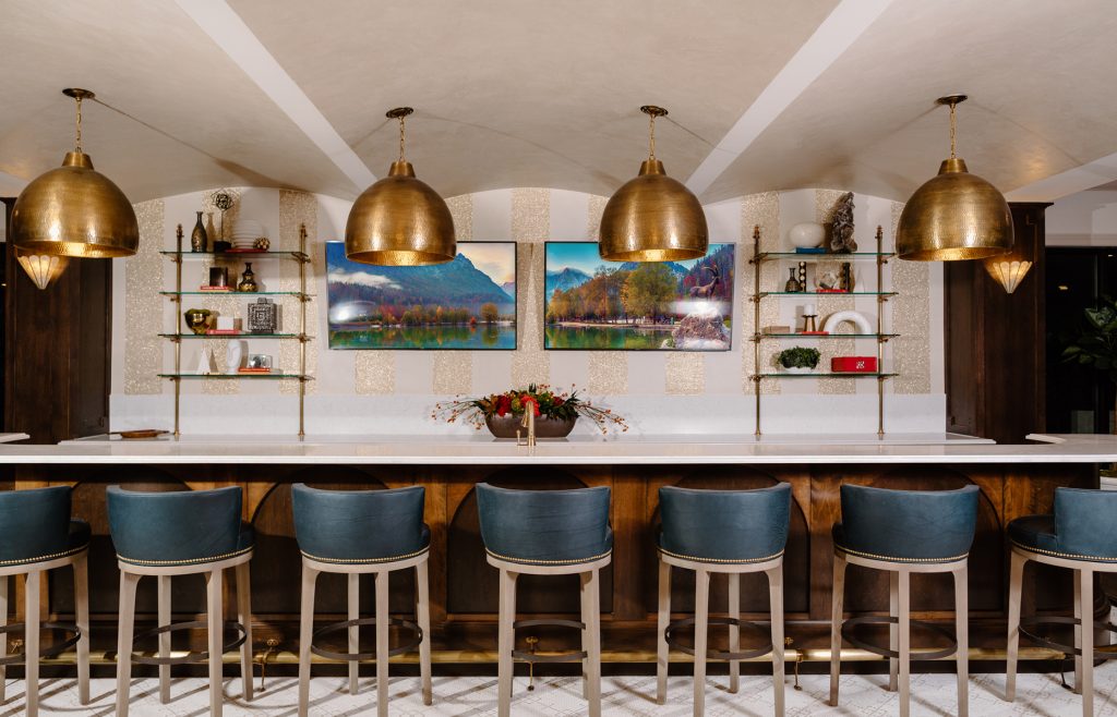 Luxe 88 Upstairs bar with mounted televisions and gold pendant lighting