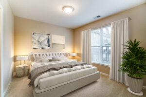 Master Bedroom of Taylor House 2 Bedroom with den unit with white furniture