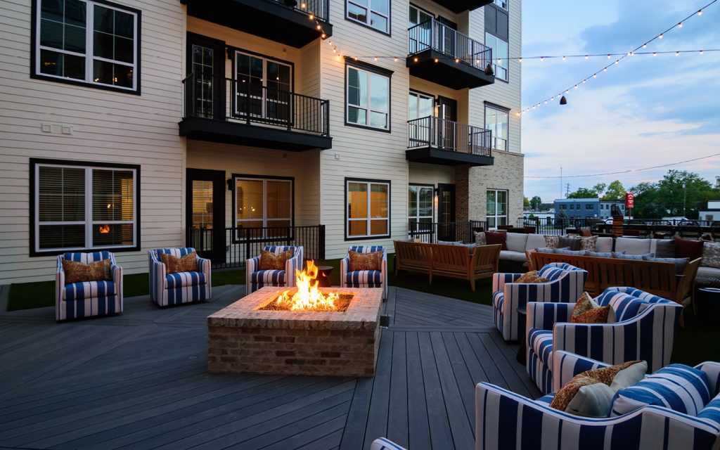 Essex Outdoor Entertainment Lounge with firepit in forefront