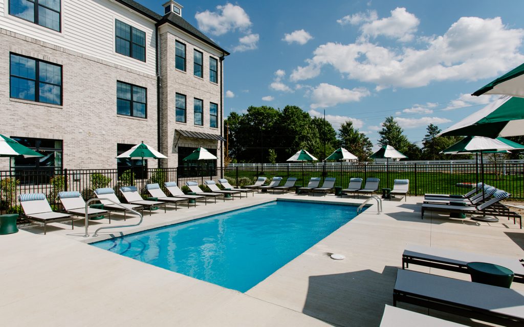 Camden Annex Pool with sunshine, blue water and relaxation furniture